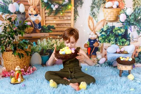 Kid on Easter egg hunt. Easter holidays Stock Photos