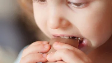 Kid eating chocolate Stock-Footage 85695455