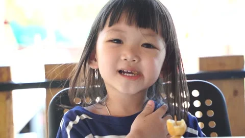 Kid eating Slomo3 Stock Footage 131872230