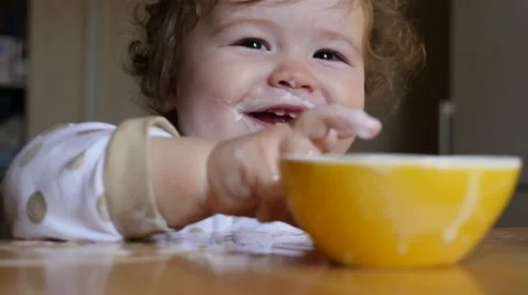 Kid eating yoghurt Stock Footage 49949667