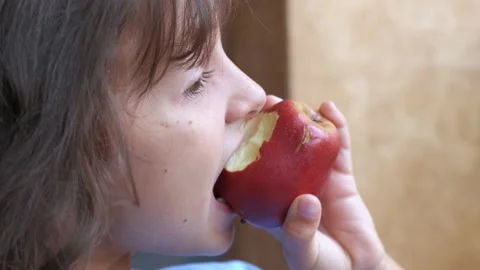 The kid eats an apple. Stock-Footage 231642615