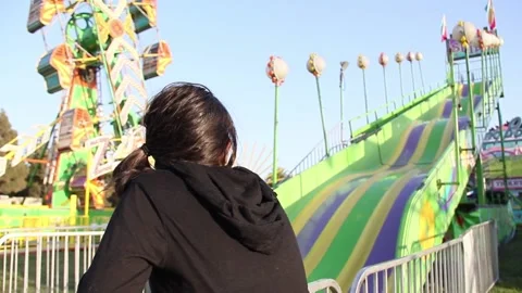 Kid by empty slide at fair Stock Footage 154939547