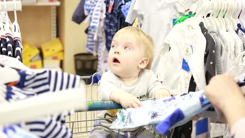 The kid examines the suit Stock-Footage 134468384