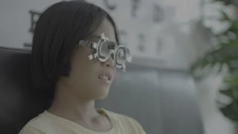 Kid eye test in optical store Stock Footage 274433918