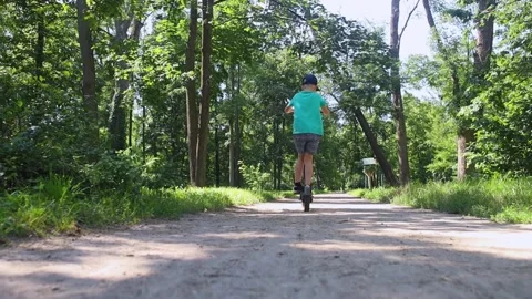 Kid fall when riding an electric scooter. Riding an e-scooter without protective Video stock 247360276