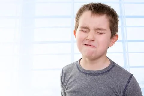 Kid feeling the pain Stock Photos