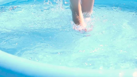 Kid feet splashing in the pool close-up slow motion Stock-Footage 159902286