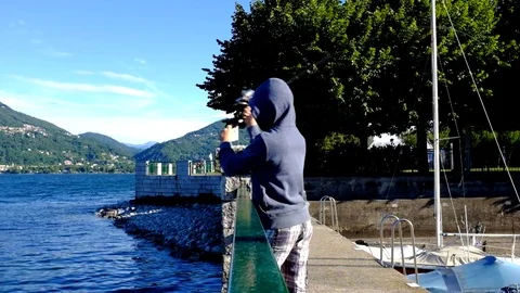 Kid fishing at the harbor Видео 78758543
