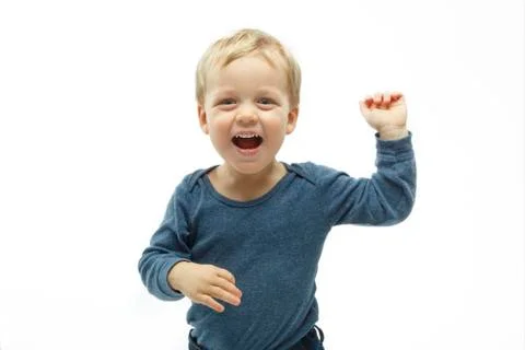 Kid with funny expression gesture open hand fingers on white background. winning Stock Photos