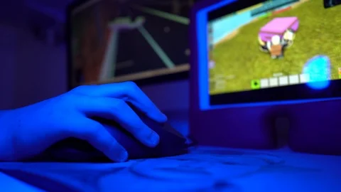 A kid gaming on multiple screens Stock Footage 86866043
