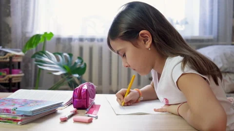 Kid girl doing homework. selective focus. Stock Footage 147481009
