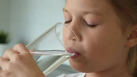 Teen boy drinking water outdoors Stock Video Footage by ©VaLiza #199836560