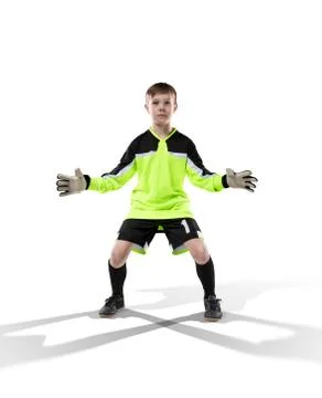 Kid goakeeper prepairing to catch the ball isolated Stock Photos