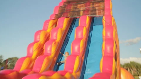 Kid going down slide Stock-Footage 49177791