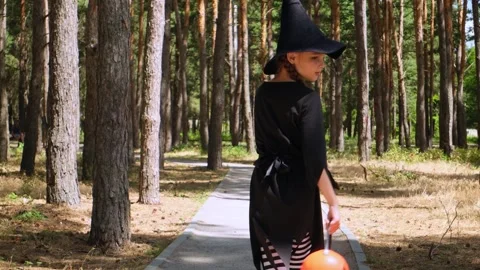 Kid going trick or treating. Low section shot of child in festive Halloween cost Stock Footage 279073329