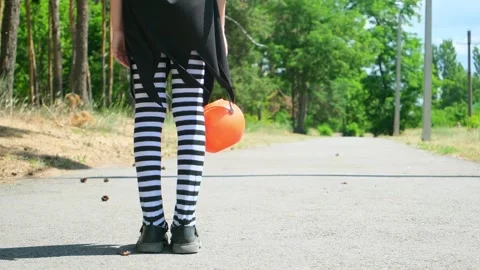 Kid going trick or treating. Low section shot of child in festive Halloween cost Stock Footage 280209577
