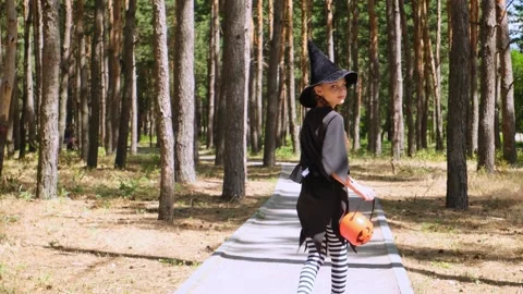 Kid going trick or treating. Low section shot of child in festive Halloween cost Stock Footage 281103319