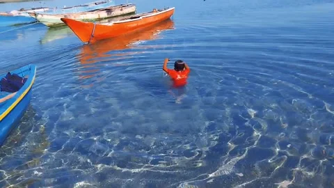 This kid is good at swimming Stock Footage 239964820