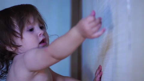 The kid got out of the box and draws on the wall Stock Footage 138729602