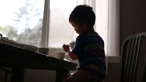 Kid grabbing cup for tea time, video Stock Footage 79563068