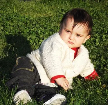 Kid on Grass Stock Photos