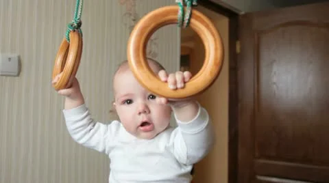 Kid on gymnastic rings Stock Footage