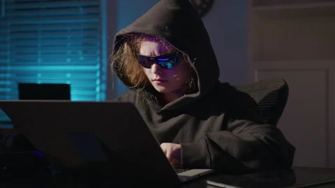 Kid hacker concentrating on computer screen. Kid hacker learning programming Video stock 346694634