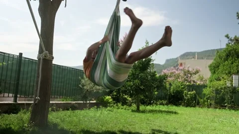 Kid on hammock Stock Footage 202511597