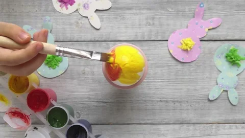 Kid hand drawing design on easter egg. Stock Footage 147357293