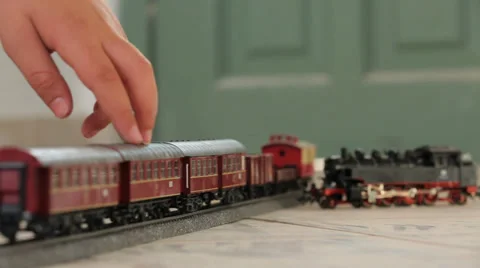 Kid hand moving Toy train Stock Footage 37558049