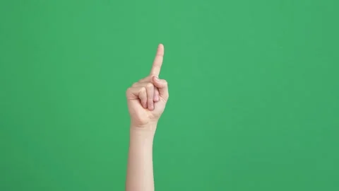 Kid hand pointing at someone or something over chroma key green screen Stock Footage 151203881