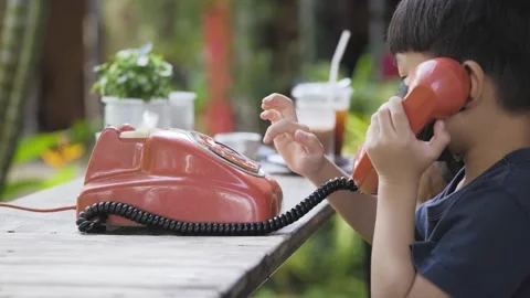 Kid hand using old rotary dial landline phone. Stock Footage 170225122