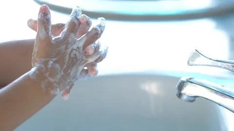 Kid hand washing with highgiene soap to prevent coronavirus covid19. Stock Footage 129570341