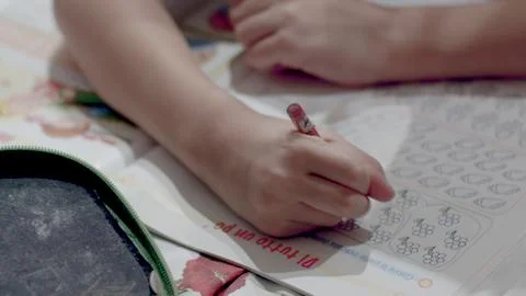 Kid hands homeworks Stock Photos