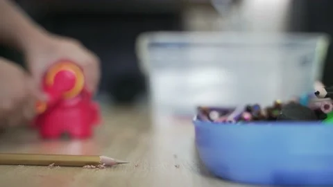 Kid hands sharpening colored pencils Video stock 131133171