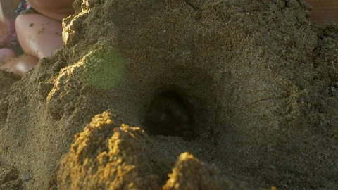 Kid having fun at seaside and making sandcastle 動画素材 86159635