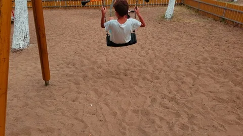 Kid having fun on a swing outdoor. Stock Footage 115362029