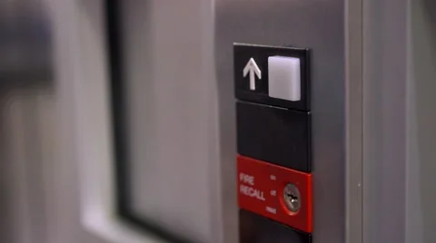 Kid hitting up arrow on elevator 4k 스톡 동영상 60843864