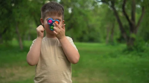 Kid Holding Rainbow Pop It Fidget Toy in Hands. Jule 2020. Kyiv, Ukraine. Video stock 159074143