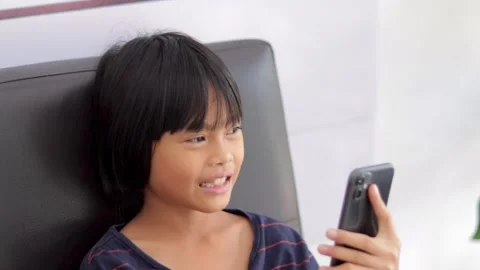 Kid holding smartphone Stock Footage 224431345