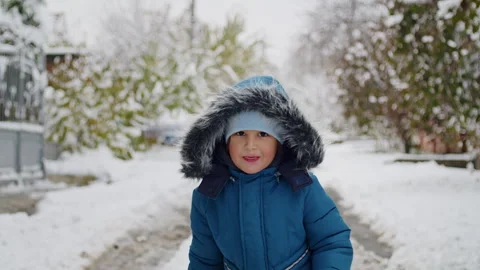 A kid, the ice, and the blizzard's challenge a tale of shoveling, strength, and Stock Footage 267276761