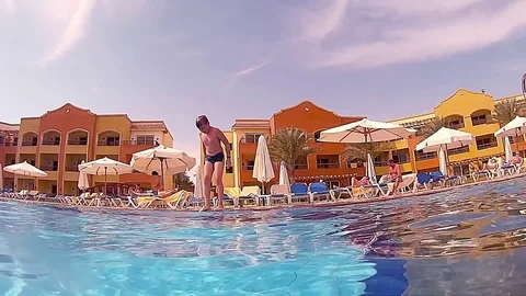 Kid jump into a pool Stock Footage 75455160