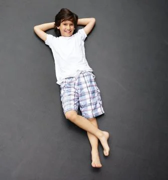 Kid jumping high up Stock Photos