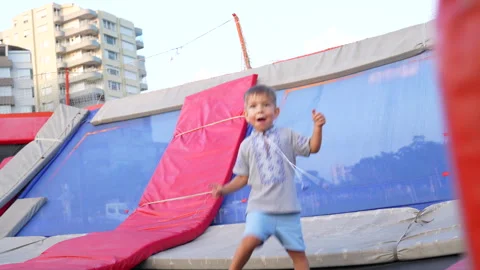 Kid jumping on the trampoline Stock Footage 282702998