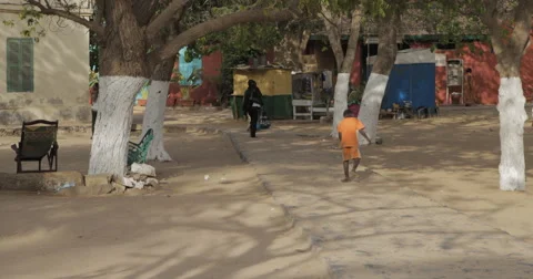 A kid junmping outside, Goree, Senegal (4K) Stock Footage 47945459