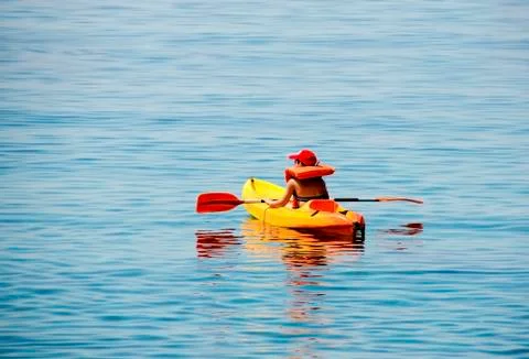 Kid kayaking, first lessons Stock Photos