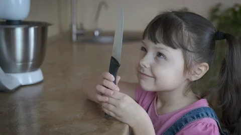 A kid with a knife. Life threatening. Stock Footage 105687889