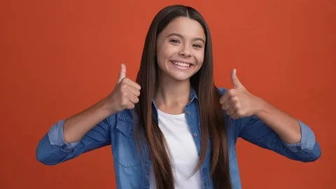 Kid lady make thumb up sign advise choose isolated crimson color background Stock Footage 166900778
