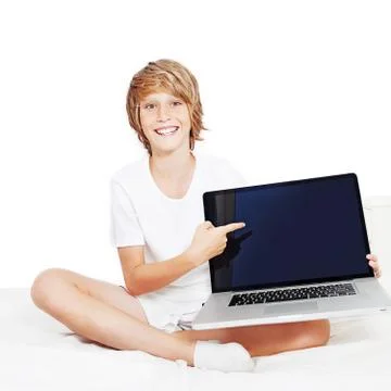 Kid with laptop computer pointing at screen Stock Photos