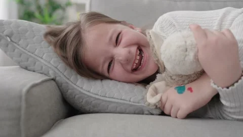 Kid laughing and looking at camera 스톡 동영상 235309100